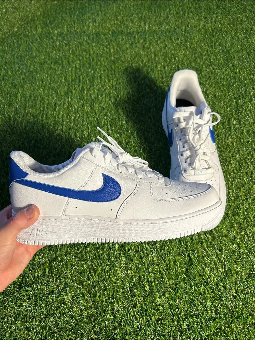 Nike White Leather Sneakers with Blue Swoosh